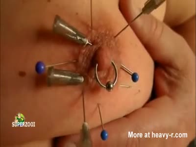 Piercing the clitoris needles torture